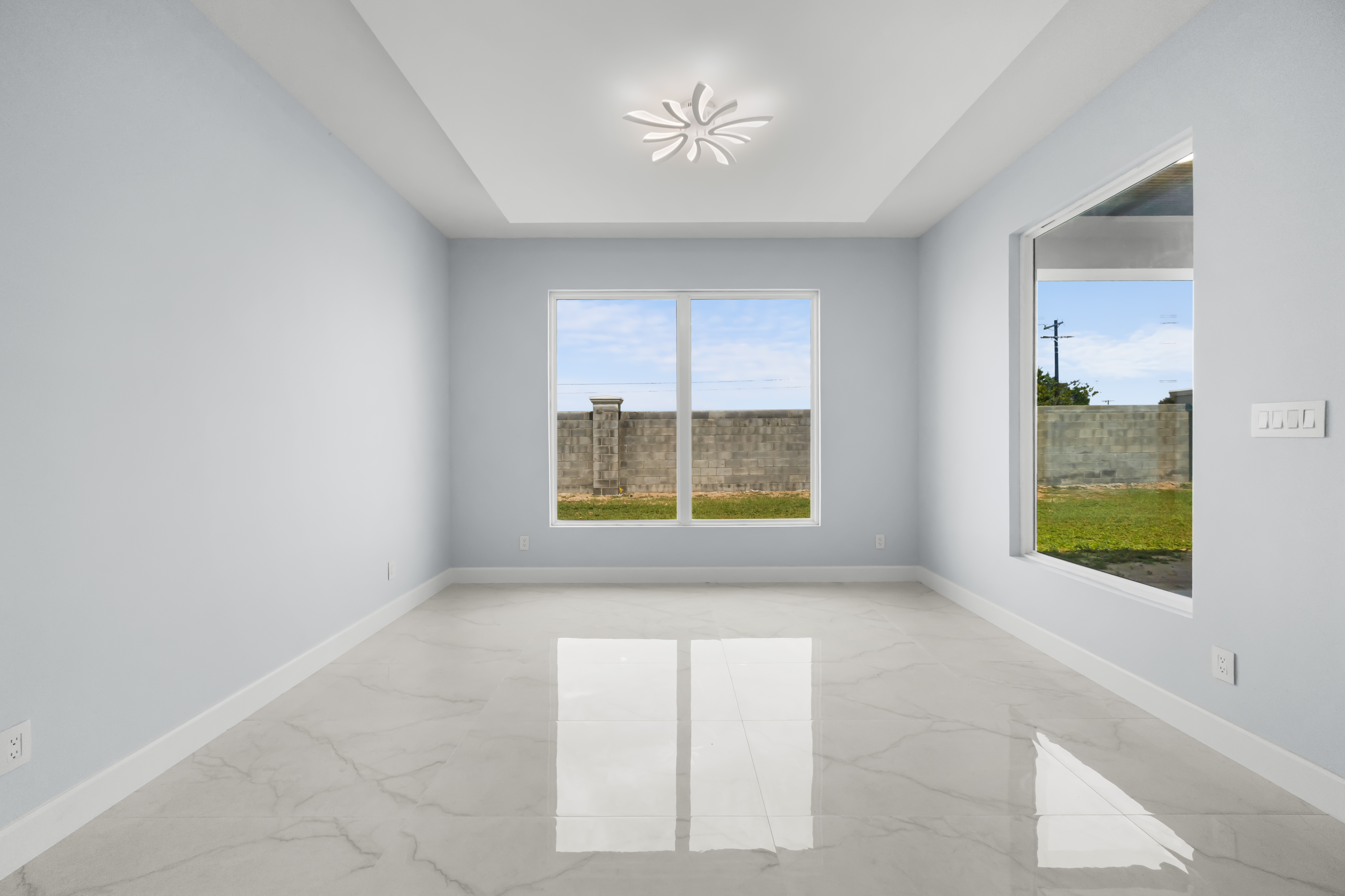 Formal room with tray ceiling and marble floor