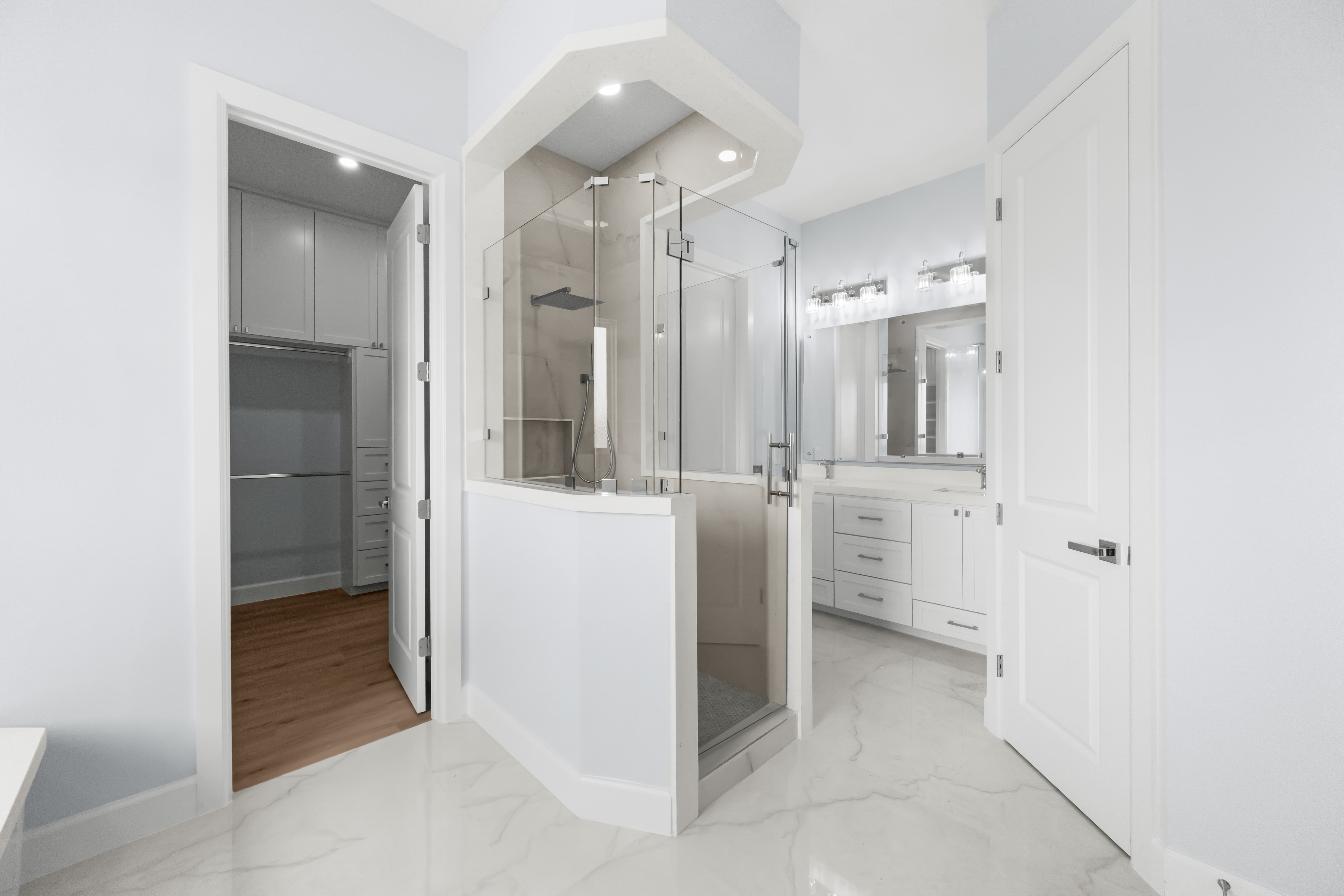 Primary bath with double shower and dual vanities