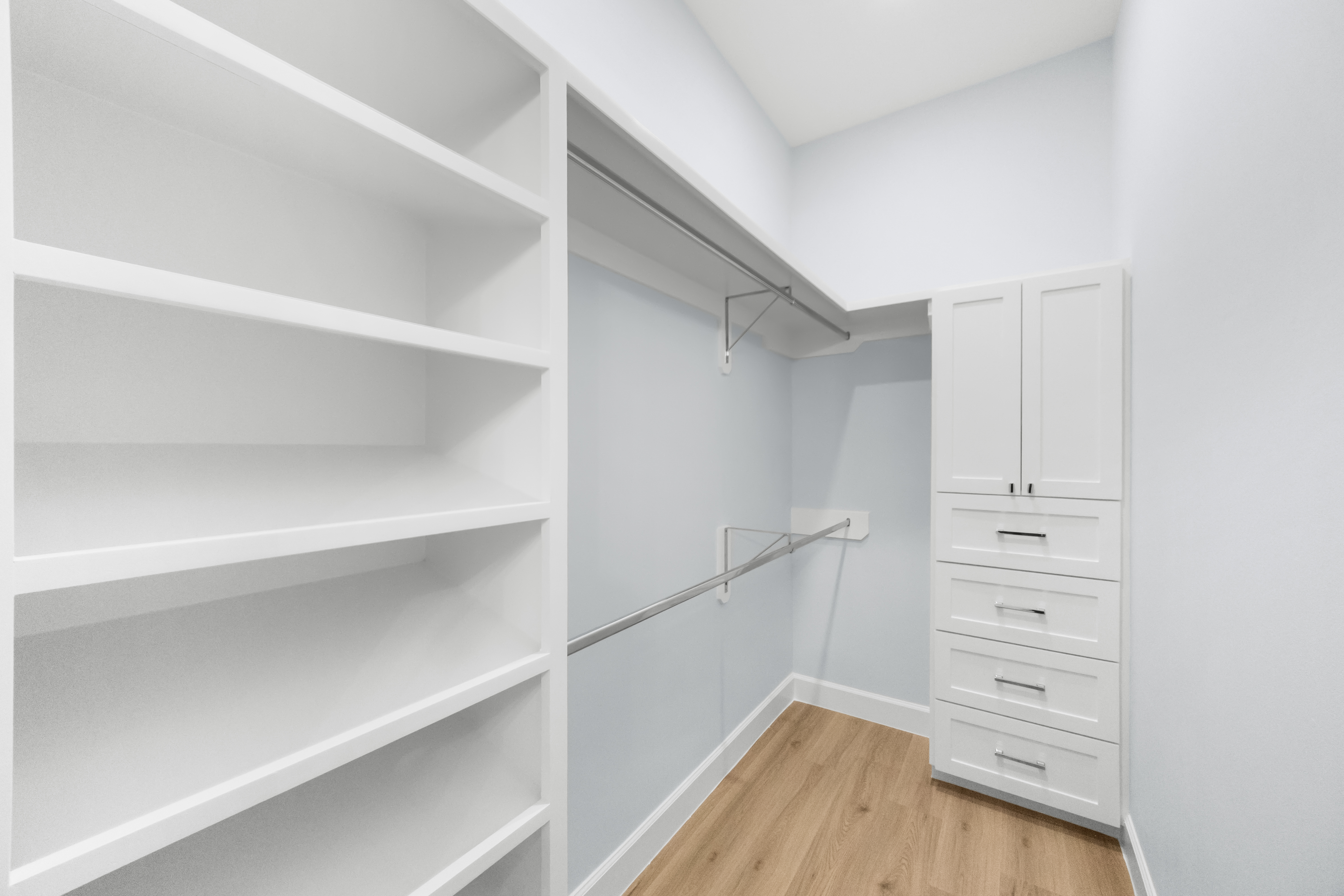 Secondary walk-in closet with shelving